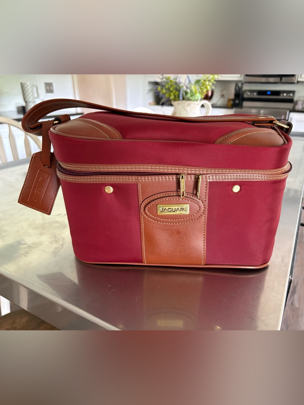 80’s vintage Jaguar burgundy soft-side train case featuring a tan center